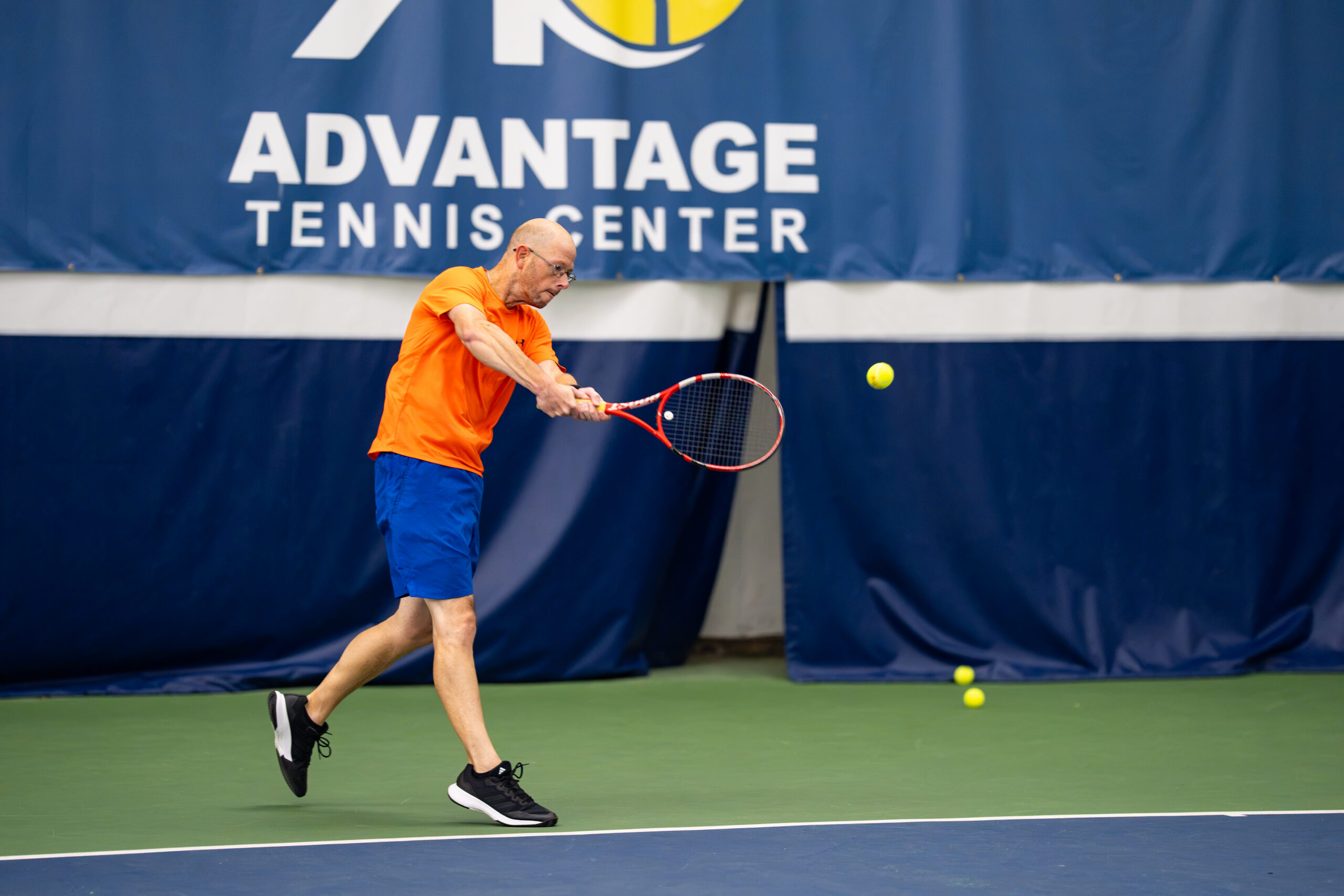 Adults playing tennis at Advantage Tennis Center